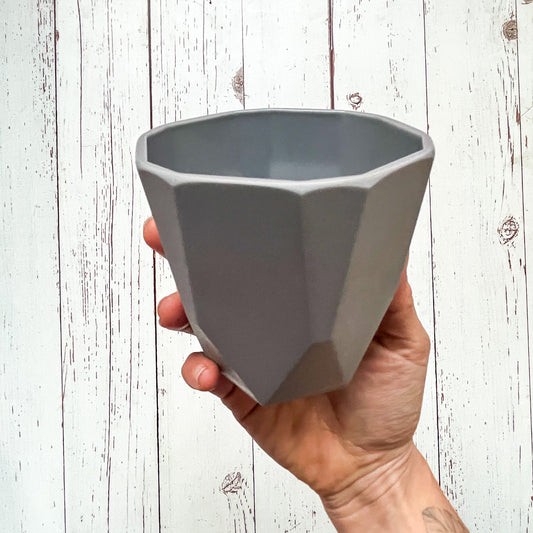 ¡Liquidación de Portamacetas - 50% de Descuento!